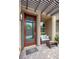 Welcoming front porch with cozy seating, a modern glass door, and stylish brick pavers at 541 Tokopah Falls St, Las Vegas, NV 89138