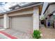Spacious garage with stone accents and clean design, complemented by a paved driveway at 541 Tokopah Falls St, Las Vegas, NV 89138