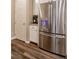 Stainless steel refrigerator complements white cabinetry and granite countertops at 541 Tokopah Falls St, Las Vegas, NV 89138
