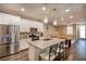 Modern kitchen with stainless steel appliances, granite countertops, and a stylish island with pendant lighting at 541 Tokopah Falls St, Las Vegas, NV 89138