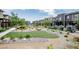 Beautiful landscaping with walking path, rocks, trees and flowers surrounding homes at 541 Tokopah Falls St, Las Vegas, NV 89138