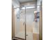 Modern shower with glass enclosure, bench seat, and dual shower heads at 541 Tokopah Falls St, Las Vegas, NV 89138