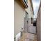 Gated side yard with gravel and stone pathway to the backyard at 541 Tokopah Falls St, Las Vegas, NV 89138