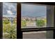 Neighborhood street view framed by a window with mountain backdrop at 541 Tokopah Falls St, Las Vegas, NV 89138