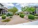 Community walking path with lush landscaping and mature trees providing shade at 541 Tokopah Falls St, Las Vegas, NV 89138