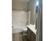 Bright bathroom featuring a shower-tub combo and neutral-toned vanity with modern fixtures at 6092 Fox Creek Ave, Las Vegas, NV 89122