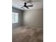 Comfortable bedroom featuring neutral-toned walls and carpet and bright natural light at 6092 Fox Creek Ave, Las Vegas, NV 89122