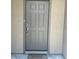 Elegant front door with decorative panels and a welcoming mat at 6092 Fox Creek Ave, Las Vegas, NV 89122