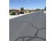 Street view of a neighborhood with cracked pavement at 6092 Fox Creek Ave, Las Vegas, NV 89122