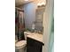 Cozy bathroom with marble countertop vanity, toilet, and shower at 6248 Sapporo Cir, Las Vegas, NV 89110