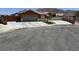 Inviting single-story home with a spacious driveway and well-maintained front yard and mountain view at 6248 Sapporo Cir, Las Vegas, NV 89110