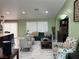Comfortable living room with stylish furniture, marble floors, and great natural lighting at 6248 Sapporo Cir, Las Vegas, NV 89110