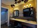 Bathroom with dual sinks, a tiled backsplash and a shower-tub combo at 6421 Doby Peak Dr, Las Vegas, NV 89108