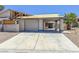 Exterior view of a distressed single-Gathering home with damaged roof and peeling paint at 6723 Oak Valley Dr, Las Vegas, NV 89103