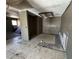 Empty kitchen area shows open wall space, bare floors, and exposed ceilings, indicating remodeling is required at 6723 Oak Valley Dr, Las Vegas, NV 89103