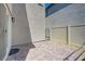 Intimate backyard boasts a stone-paved patio and secure fencing, an ideal space for relaxation at 6940 Crescent Gold St, North Las Vegas, NV 89086