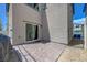 Cozy backyard with a stone-paved patio and sliding door access, offering a private outdoor space at 6940 Crescent Gold St, North Las Vegas, NV 89086