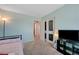 Bedroom featuring chalkboard doors, bright walls, and neutral carpet at 6940 Crescent Gold St, North Las Vegas, NV 89086