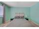 Bright bedroom featuring modern furniture, a large window, and neutral carpet at 6940 Crescent Gold St, North Las Vegas, NV 89086