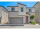 Contemporary two-story home with a two-car garage and desert landscaping at 6940 Crescent Gold St, North Las Vegas, NV 89086