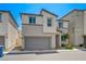 Contemporary two-story home with a two-car garage with minimal landscaping at 6940 Crescent Gold St, North Las Vegas, NV 89086