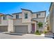 Contemporary two-story home with a two-car garage and desert landscaping at 6940 Crescent Gold St, North Las Vegas, NV 89086