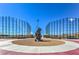 Modern baseball field complex with netted fences and shade structures under a clear blue sky at 7095 Mountain Den Ave, Las Vegas, NV 89179