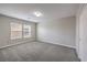 Neutral bedroom with a window at 7095 Mountain Den Ave, Las Vegas, NV 89179
