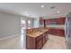 Gourmet kitchen featuring granite countertops, stainless appliances, and bar seating at 7095 Mountain Den Ave, Las Vegas, NV 89179