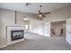 Open-concept living room featuring a fireplace and easy access to the upper level at 7095 Mountain Den Ave, Las Vegas, NV 89179