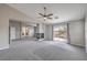 Bright living room with fireplace and sliding door access to the balcony at 7095 Mountain Den Ave, Las Vegas, NV 89179
