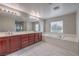 Elegant bathroom features double sinks, a long vanity, and a luxurious soaking tub at 7095 Mountain Den Ave, Las Vegas, NV 89179