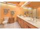 Bathroom featuring a double sink vanity, bright lighting, and modern fixtures at 7460 Buckskin Ave, Las Vegas, NV 89129