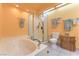 Bright bathroom featuring a jetted tub and separate glass-enclosed shower at 7460 Buckskin Ave, Las Vegas, NV 89129