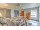 Comfortable bedroom includes a ceiling fan, natural light, and spacious closets at 7460 Buckskin Ave, Las Vegas, NV 89129