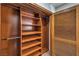 Organized closet with wooden shelving and ample storage space at 7460 Buckskin Ave, Las Vegas, NV 89129