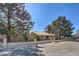 Charming single-story home featuring a desert landscaped yard and a secure wrought iron fence at 7460 Buckskin Ave, Las Vegas, NV 89129