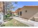 Inviting home exterior with lush landscaping, mature trees, and a well-maintained lawn at 7460 Buckskin Ave, Las Vegas, NV 89129