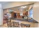 Well-appointed kitchen offering a breakfast bar, ample counter space, and views into the adjacent dining room at 7460 Buckskin Ave, Las Vegas, NV 89129