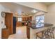 Spacious kitchen featuring granite countertops, stainless steel appliances, and a breakfast bar with seating at 7460 Buckskin Ave, Las Vegas, NV 89129