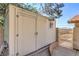 Exterior view of a shed with a nearby gated entrance at 7460 Buckskin Ave, Las Vegas, NV 89129