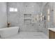 Bright bathroom with a modern tub, walk-in shower, and stylish vanity at 7738 Willow Cove Cir, Las Vegas, NV 89129