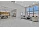 Open concept living room with adjacent kitchen and dining area flooded with light at 7738 Willow Cove Cir, Las Vegas, NV 89129