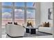 Bright living room with a cozy seating arrangement and expansive backyard views at 7738 Willow Cove Cir, Las Vegas, NV 89129
