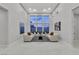Bright living room with high ceilings, modern furnishings, and large windows at 7738 Willow Cove Cir, Las Vegas, NV 89129