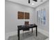 Simple home office with a desk, chair, and window with light blocking shutters at 7738 Willow Cove Cir, Las Vegas, NV 89129