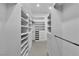 Spacious walk-in closet featuring custom shelving and ample storage at 7738 Willow Cove Cir, Las Vegas, NV 89129