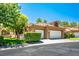 Attractive home featuring a tile roof, two-car garage and manicured landscaping for curb appeal at 8236 Round Hills Cir, Las Vegas, NV 89113