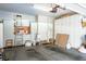 Spacious garage with built in cabinets and storage, providing ample room for vehicles and organization at 8236 Round Hills Cir, Las Vegas, NV 89113