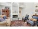 Inviting living room with a fireplace, comfortable seating, and classic decor at 8236 Round Hills Cir, Las Vegas, NV 89113